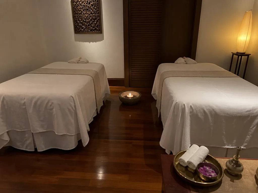 Couples spa room with two massage beds and candles