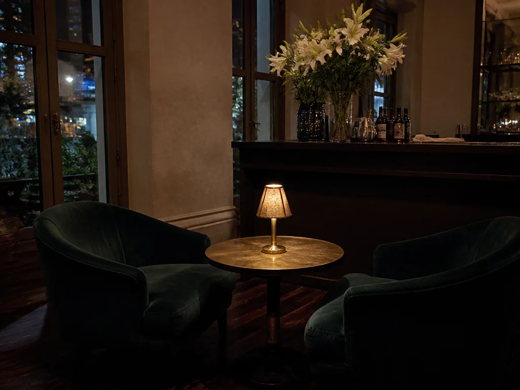 Quiet hotel lobby bar with two armchairs and small table