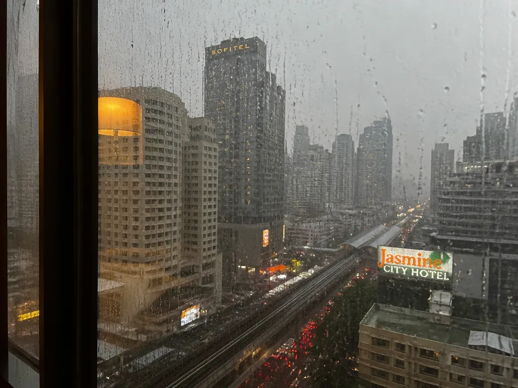 Bangkok afternoon monsoon downpour seen from hotel window