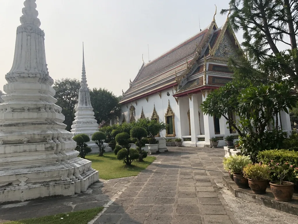 Riverside rooftop bar table with view of Wat Arun at sunset