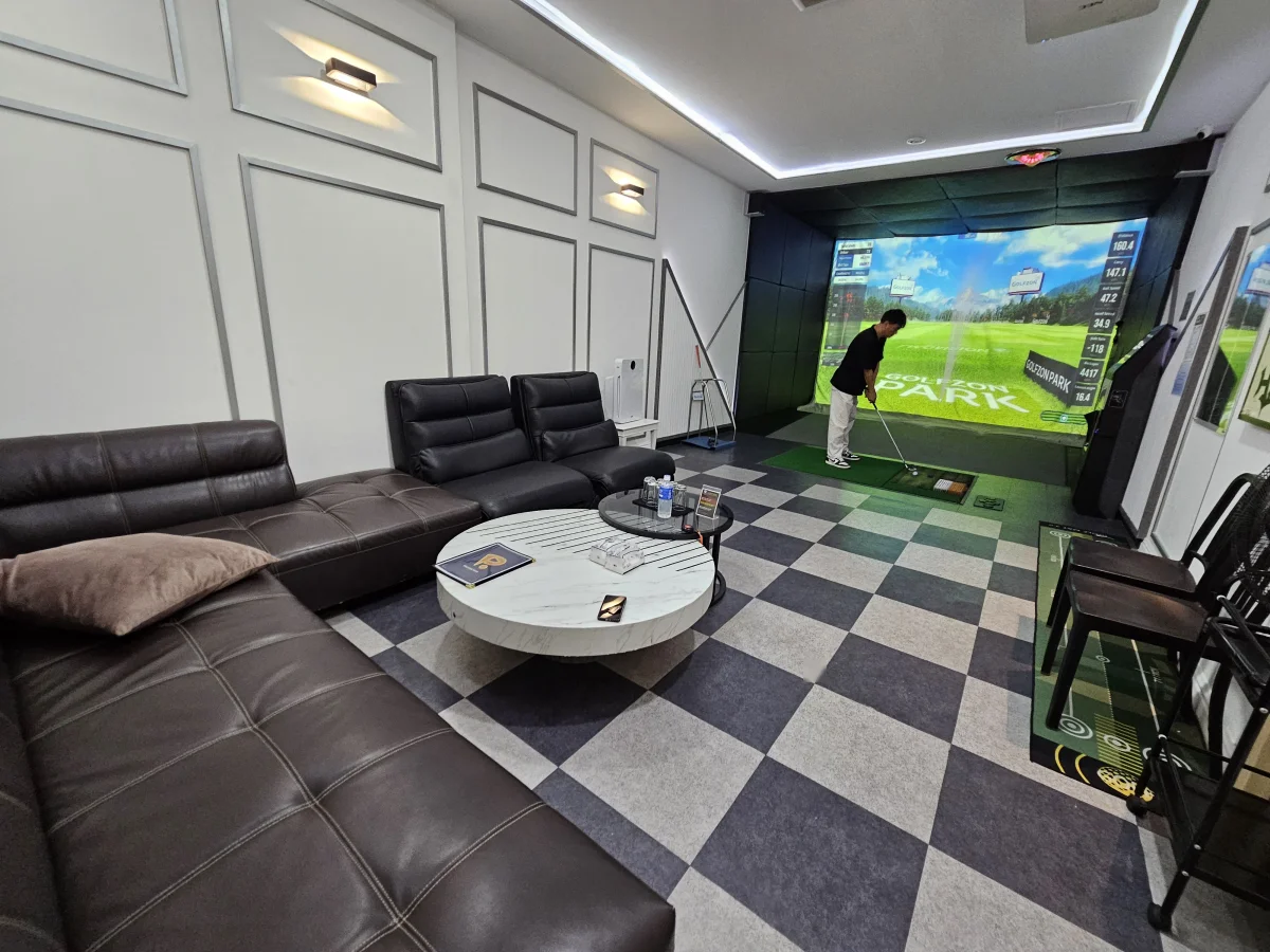 Private lounge with leather sofa and checkered floor