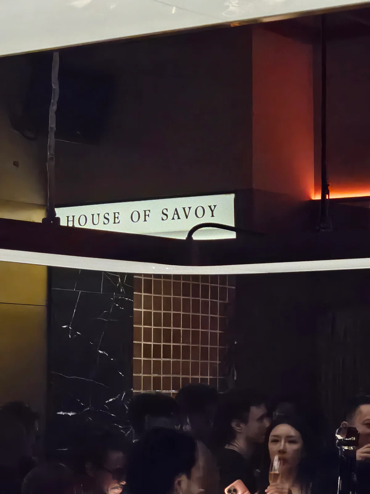 House of Savoy Bangkok entrance sign on marble wall
