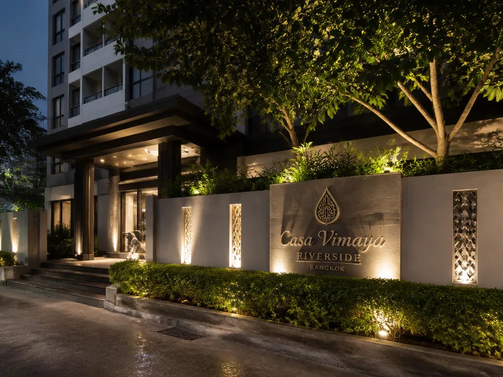 Bangkok hotel exterior at night with illuminated entrance signage