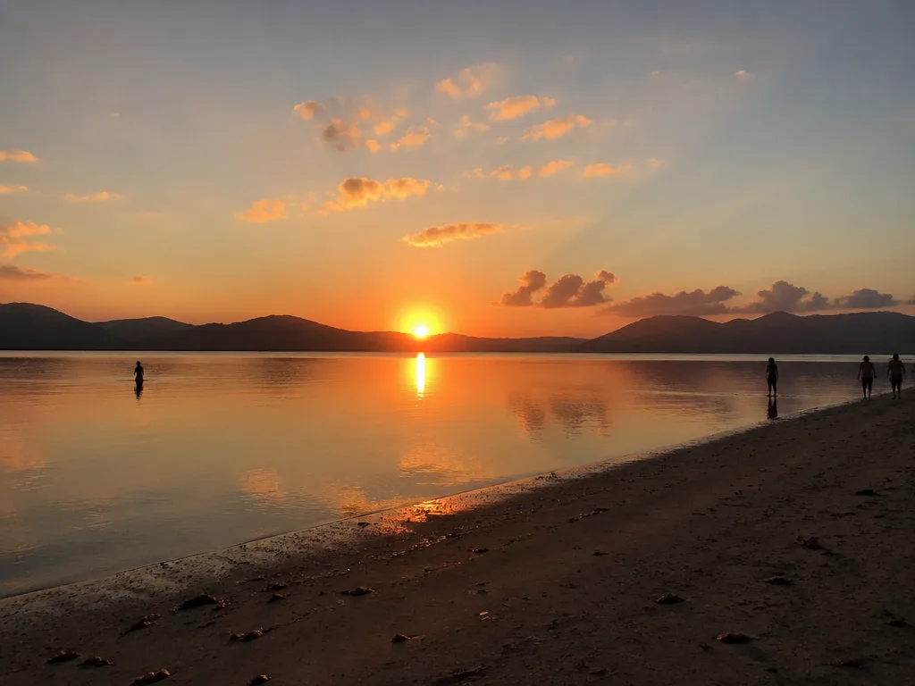 Lipa Noi beach golden sunset over calm water