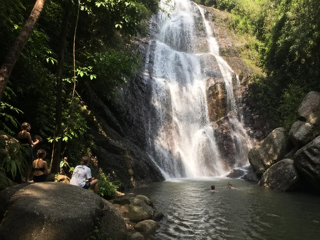Na Muang waterfall pool with mossy boulders