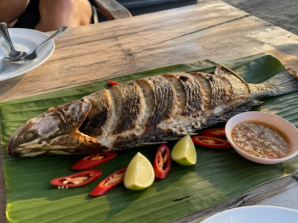 Whole grilled sea bass with lime and chili at a Koh Samui seafood shack