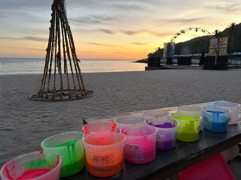 Haad Rin beach setup before Full Moon Party with paint stations and unlit bonfires
