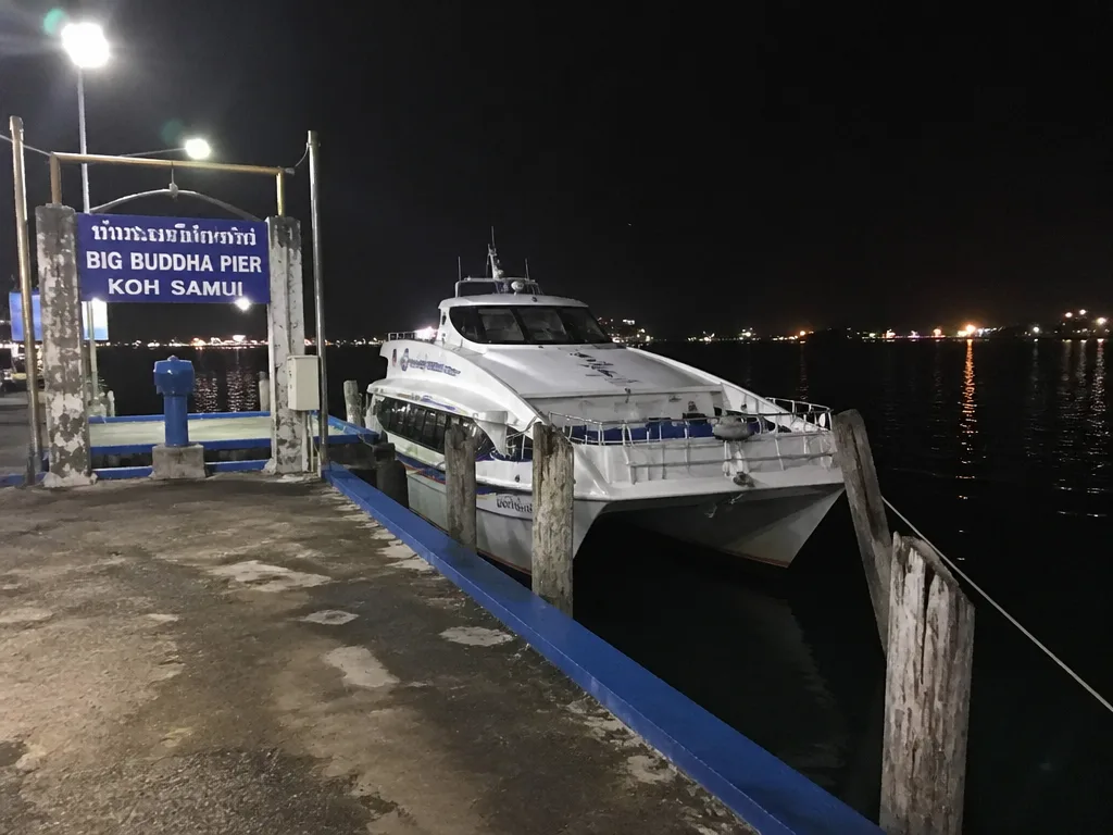 Big Buddha Pier at night with empty ferry waiting under harbor lights
