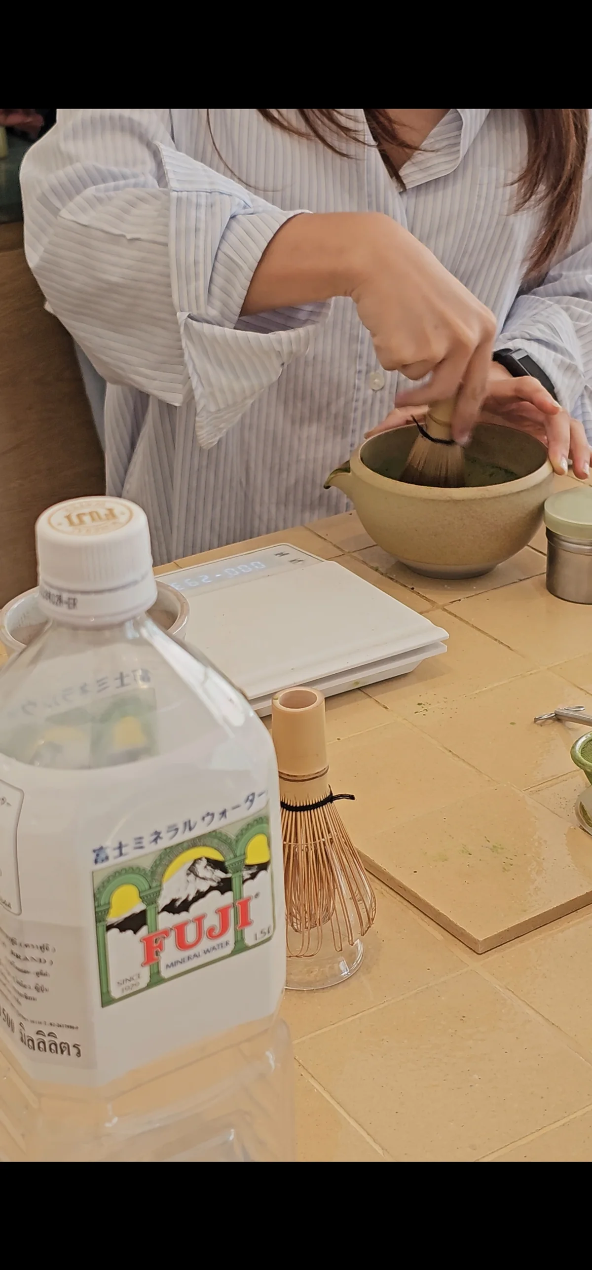 Matcha whisked to order with Fuji mineral water at the counter