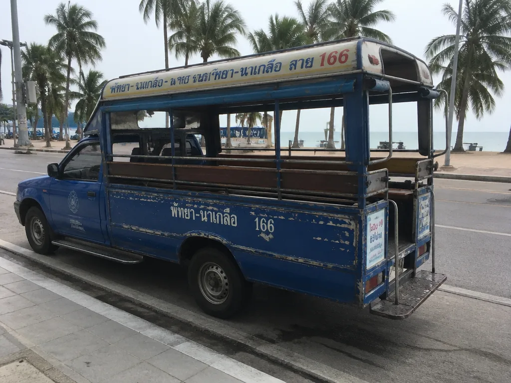 Pattaya Songthaew baht bus parked on Beach Road