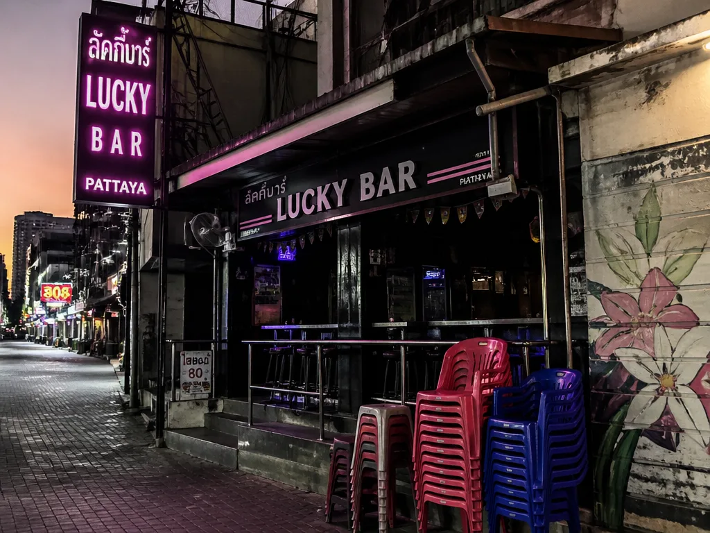 Empty go-go bar facade with vertical neon Walking Street