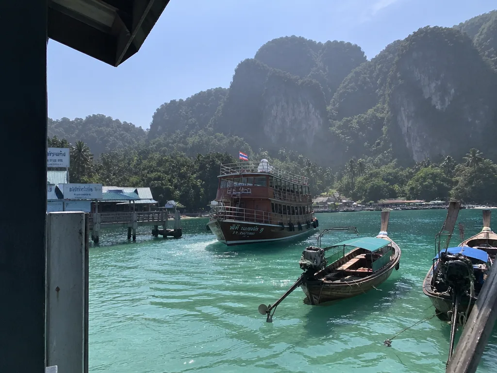 Wooden ferry approaching Tonsai Pier on Phi Phi Don