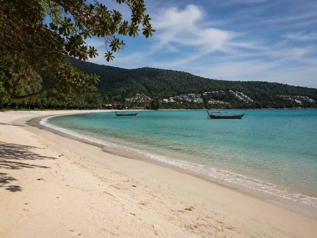 Kata Beach crescent with calm sea and forested hills