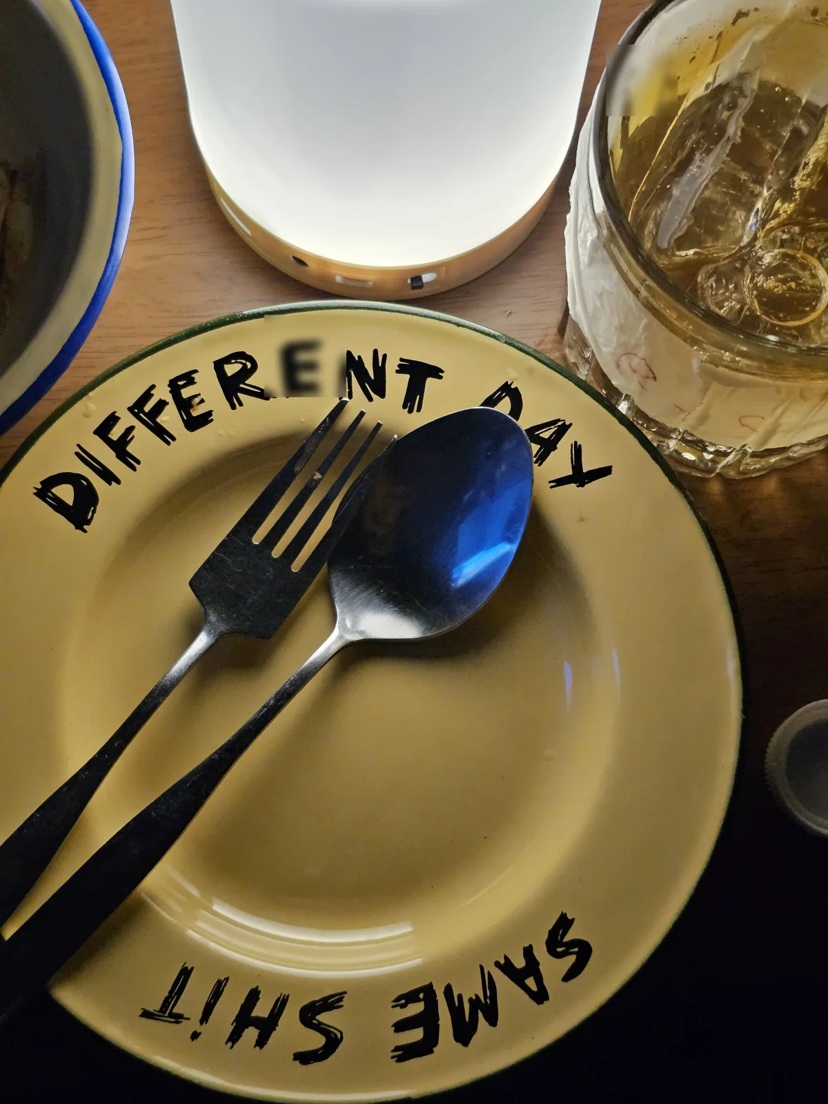 Plate stamped with the SAME SHIT DIFFERENT DAY logo
