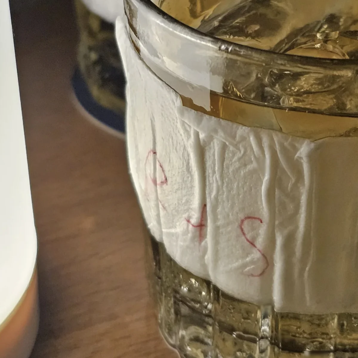 Napkin marked R and S wrapped around a Regency soda glass