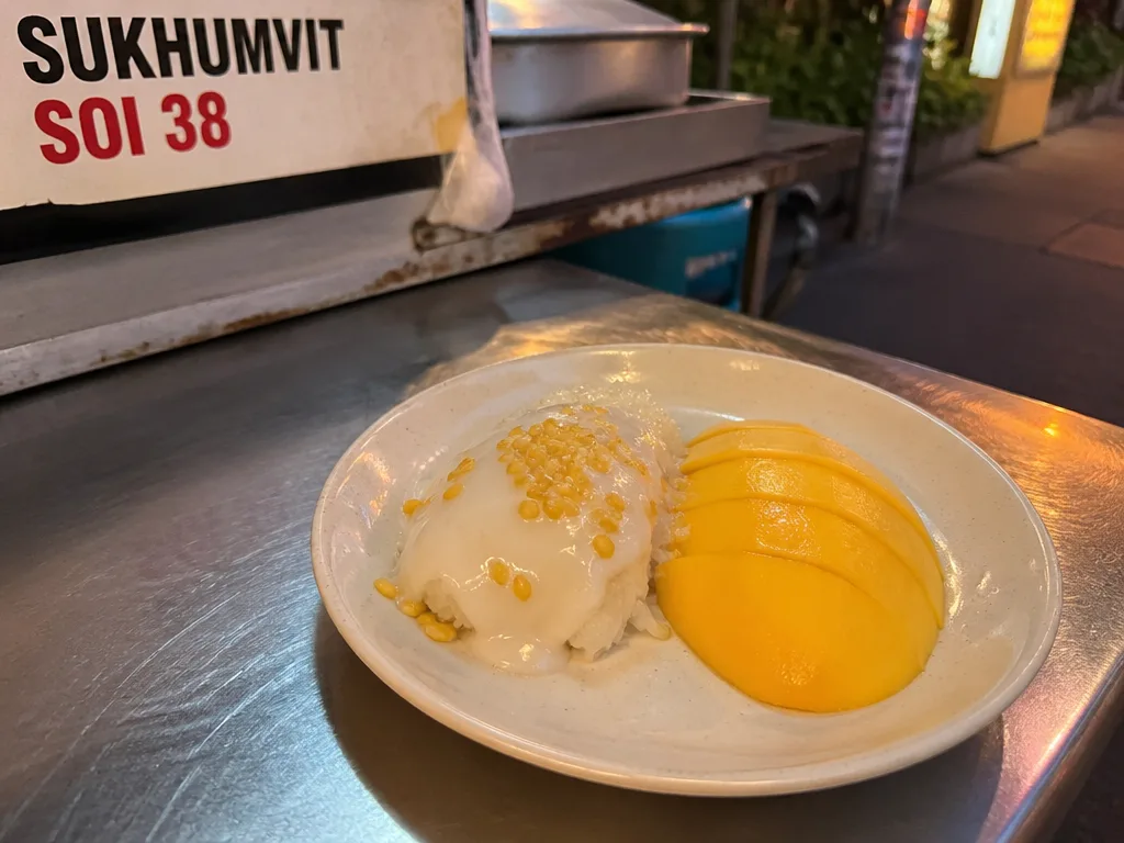 Mango sticky rice plate with fresh ripe mango and coconut cream
