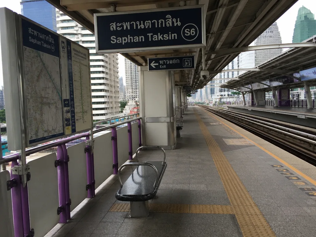 Bangkok BTS Skytrain platform with bilingual signage