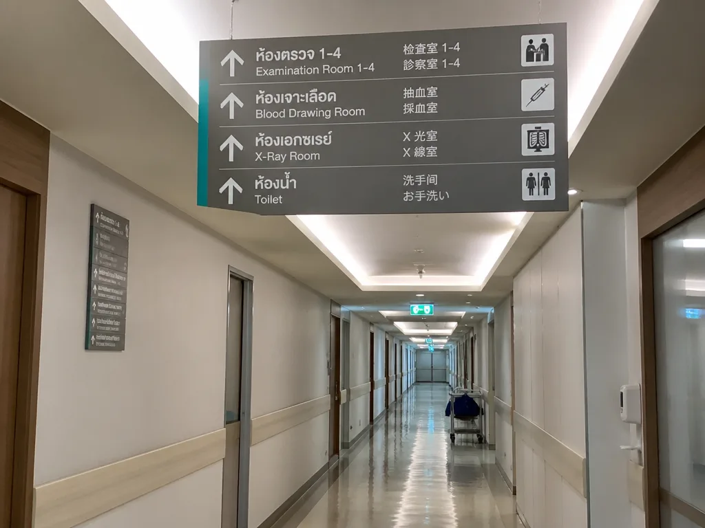 Bangkok hospital corridor with international signage