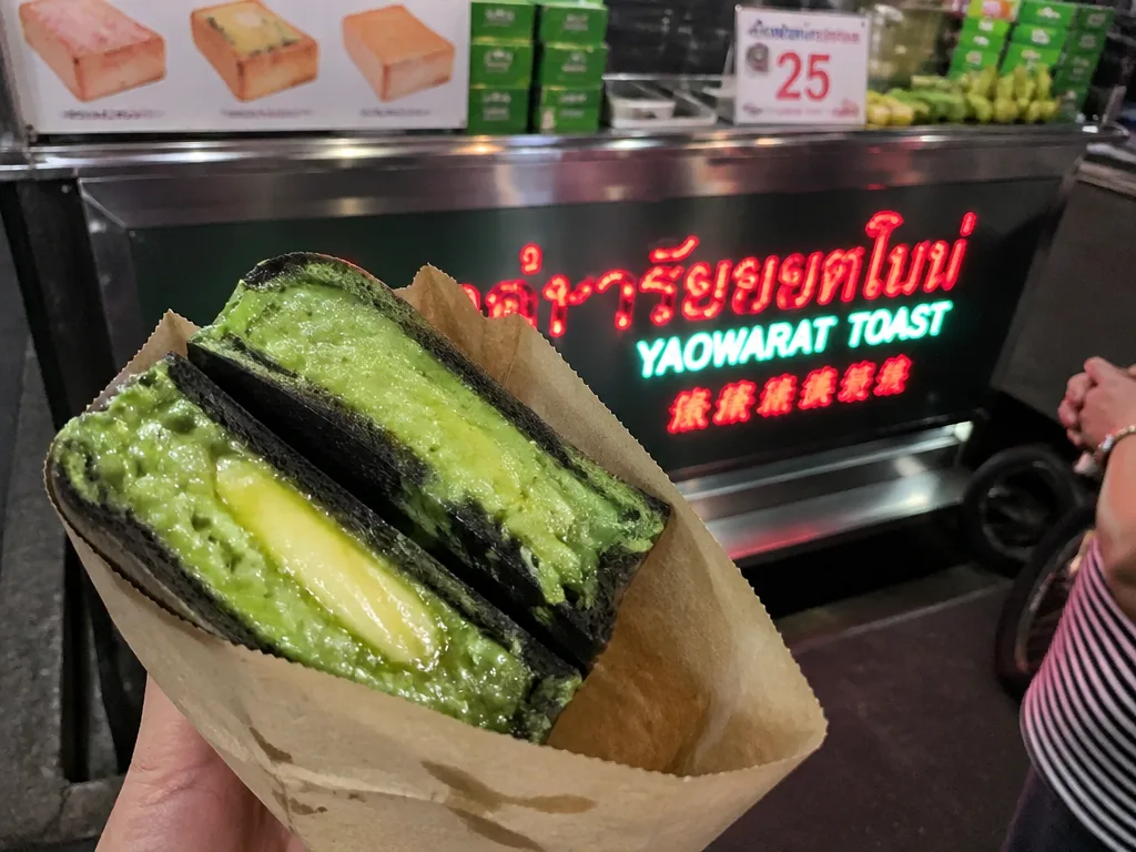 Charcoal-toasted Thai bread topped with butter and pandan custard