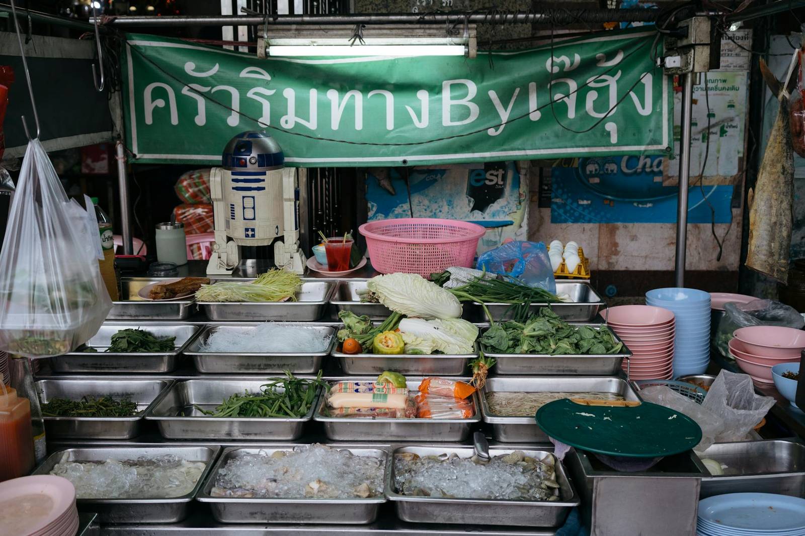 Street food vendors serving up fresh dishes along Yaowarat's side alleys